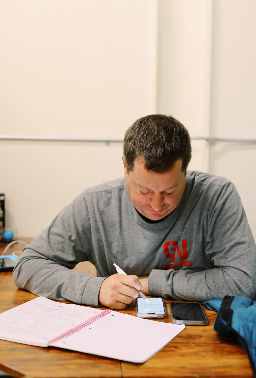 Good Wood project manager reviewing drawings