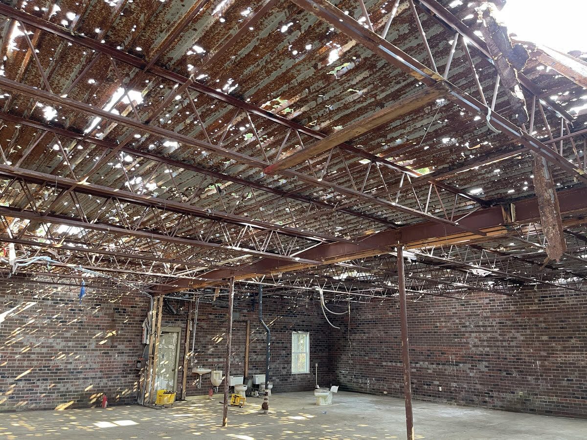 Interior of a fire-damaged building stripped back to structure